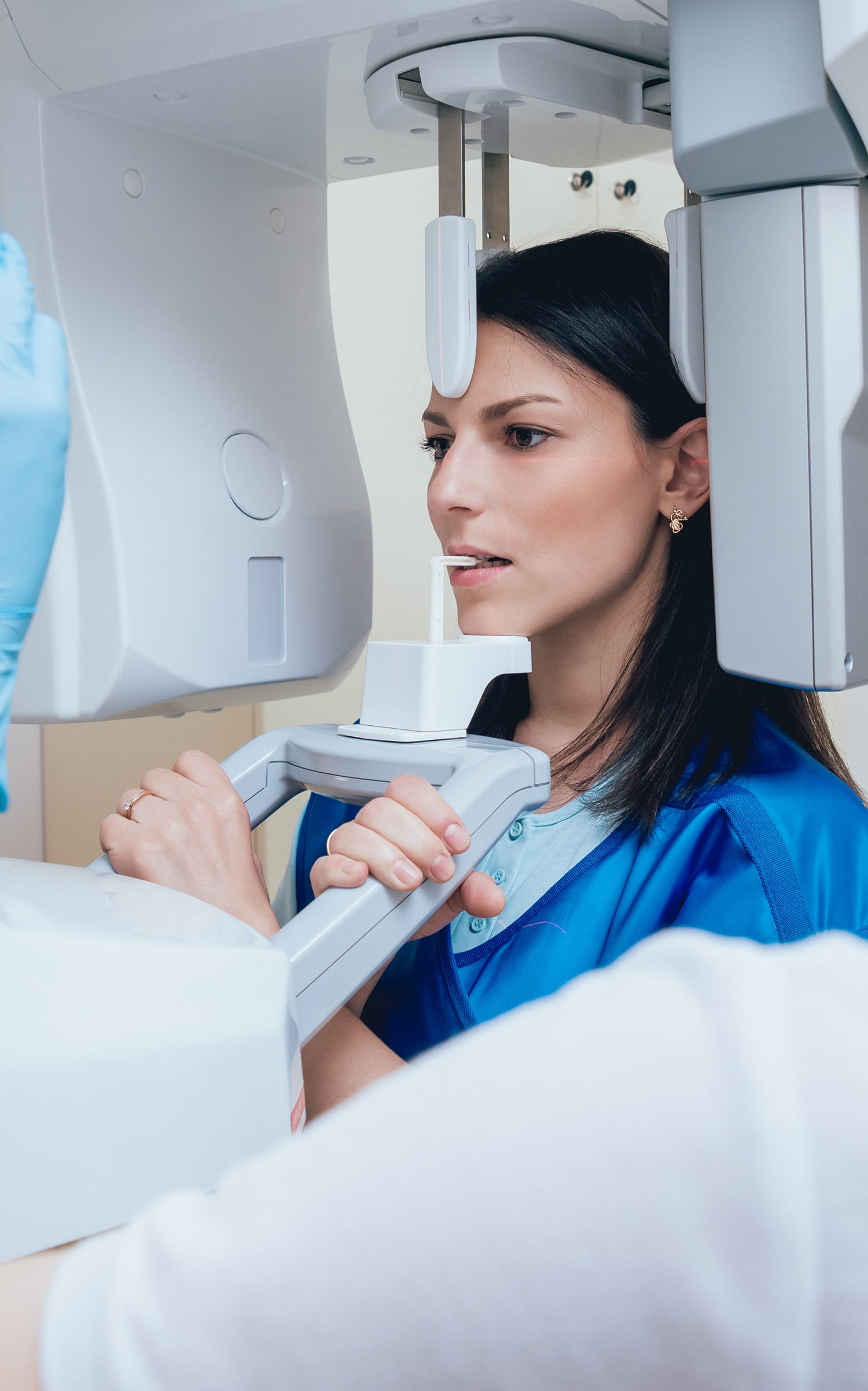 Young woman patient standing in x-ray machine. tavistock dentist